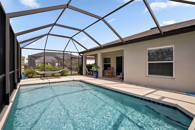 5511 Badini Way, Palmetto, FL 34221 - outdoor pool with a patio area and glass enclosure
