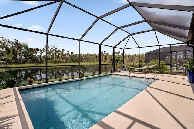 5511 Badini Way, Palmetto, FL 34221 - outdoor pool featuring a water view, a patio, glass enclosure, and view of wooded area