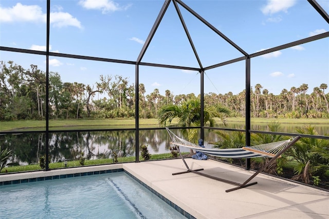 5511 Badini Way, Palmetto, FL 34221 - swimming pool featuring a water view, glass enclosure, a patio area, and view of wooded area