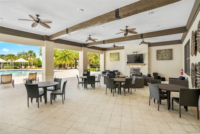 5511 Badini Way, Palmetto, FL 34221 - view of patio / terrace with outdoor dining area, a ceiling fan, an outdoor pool, and an outdoor living space
