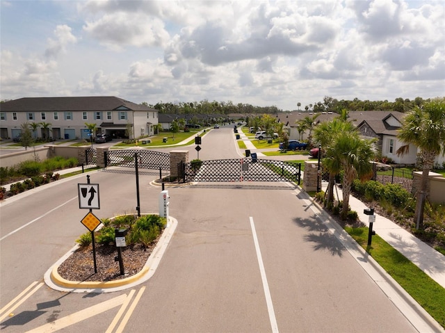 5511 Badini Way, Palmetto, FL 34221 - view of asphalt street with a residential view, curbs, and traffic signs