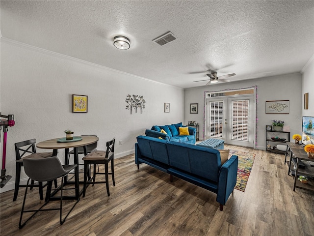4221 W Spruce St Unit 2302, Tampa, FL 33607 - living room featuring ceiling fan, wood finished floors, a textured ceiling, crown molding, and baseboards