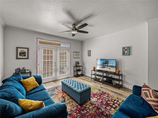 4221 W Spruce St Unit 2302, Tampa, FL 33607 - living area with ceiling fan, crown molding, french doors, wood finished floors, and a textured ceiling