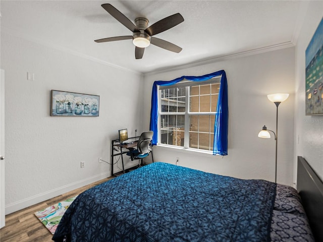 4221 W Spruce St Unit 2302, Tampa, FL 33607 - bedroom featuring crown molding, wood finished floors, baseboards, and ceiling fan