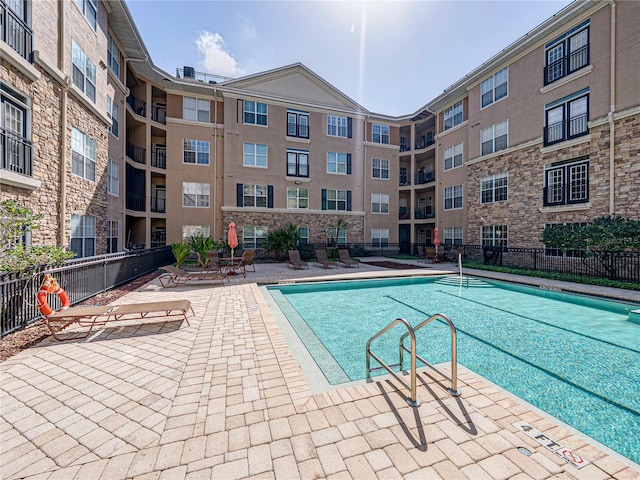 4221 W Spruce St Unit 2302, Tampa, FL 33607 - community pool featuring a patio area