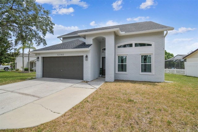 12102 Steppingstone Blvd, Tampa, FL 33635 - view of front of house featuring a garage, driveway, roof with shingles, and brick siding