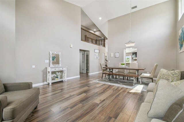 12102 Steppingstone Blvd, Tampa, FL 33635 - living room with a high ceiling, wood finished floors, baseboards, a chandelier, and recessed lighting