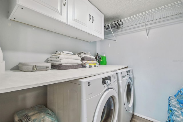 12102 Steppingstone Blvd, Tampa, FL 33635 - laundry area with washing machine and dryer, cabinet space, and a textured ceiling