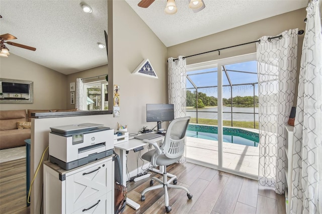 12102 Steppingstone Blvd, Tampa, FL 33635 - office with ceiling fan, lofted ceiling, a textured ceiling, and wood finished floors