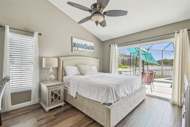 12102 Steppingstone Blvd, Tampa, FL 33635 - bedroom featuring access to outside, vaulted ceiling, a textured ceiling, dark wood finished floors, and a ceiling fan