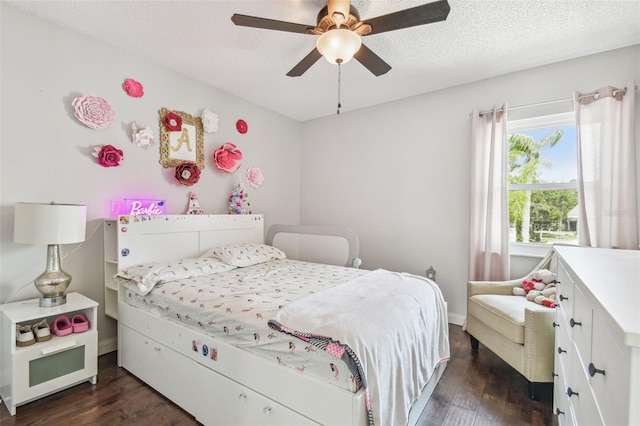 12102 Steppingstone Blvd, Tampa, FL 33635 - bedroom with dark wood-style floors, a ceiling fan, a textured ceiling, and baseboards