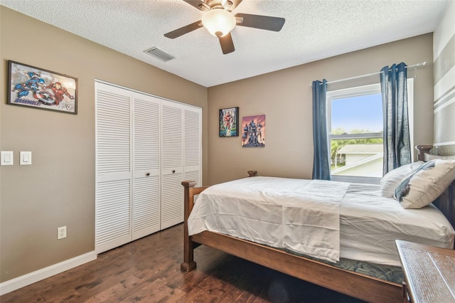 12102 Steppingstone Blvd, Tampa, FL 33635 - bedroom with wood finished floors, a closet, baseboards, a textured ceiling, and a ceiling fan