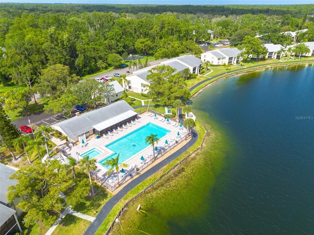 3114 Lake Pine Way Unit G1, Tarpon Springs, FL 34688 - bird's eye view of a pool area, a forest, and a large body of water