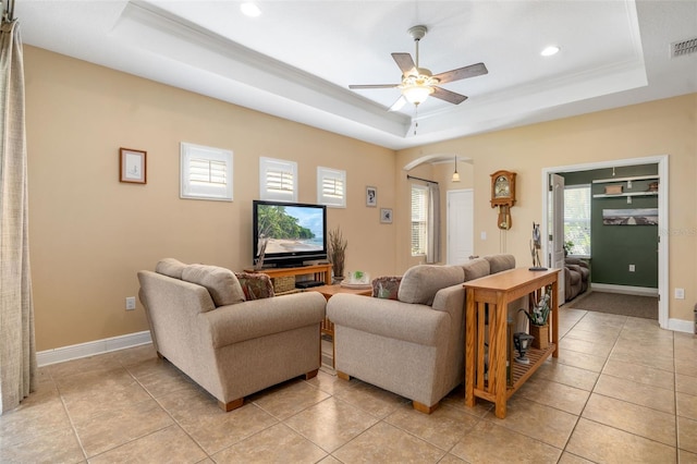 11813 Crawford Parrish Ln, Parrish, FL 34219 - living area with a raised ceiling, arched walkways, a ceiling fan, recessed lighting, and light tile patterned flooring