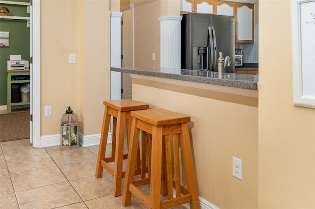 11813 Crawford Parrish Ln, Parrish, FL 34219 - corridor featuring light tile patterned flooring and baseboards