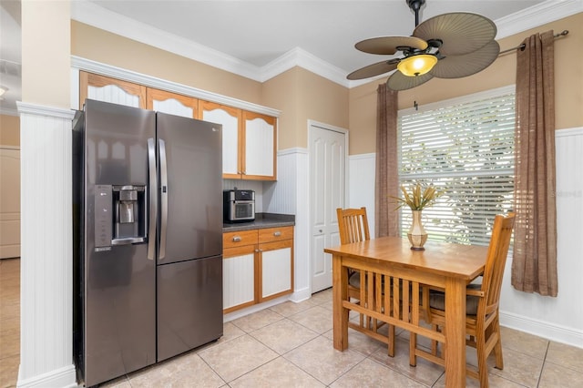 11813 Crawford Parrish Ln, Parrish, FL 34219 - kitchen featuring stainless steel fridge, a ceiling fan, dark countertops, ornamental molding, and light tile patterned floors