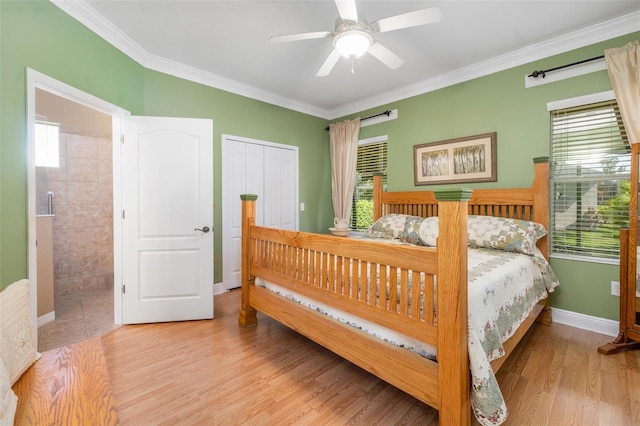 11813 Crawford Parrish Ln, Parrish, FL 34219 - bedroom with multiple windows, ornamental molding, wood finished floors, a ceiling fan, and baseboards