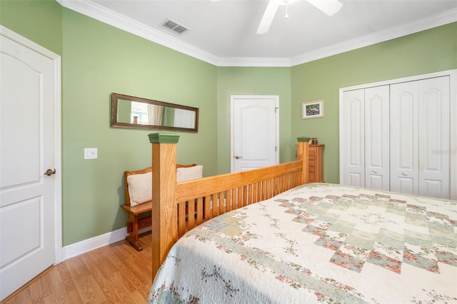 11813 Crawford Parrish Ln, Parrish, FL 34219 - bedroom featuring ornamental molding, a closet, light wood finished floors, baseboards, and ceiling fan