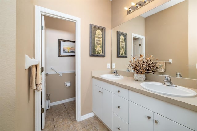 11813 Crawford Parrish Ln, Parrish, FL 34219 - bathroom with double vanity, tile patterned flooring, and baseboards