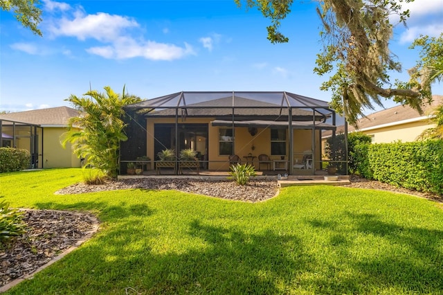 11813 Crawford Parrish Ln, Parrish, FL 34219 - rear view of property featuring a lawn, a patio area, and glass enclosure