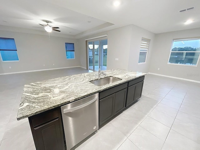 13014 Willow Grove Dr, Riverview, FL 33579 - kitchen with stainless steel dishwasher, open floor plan, a sink, and light stone countertops