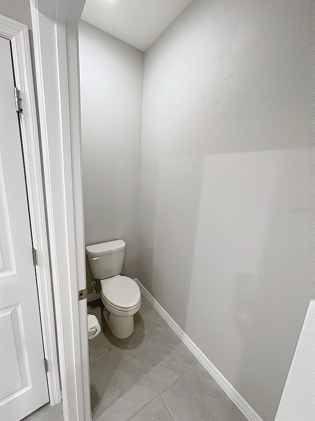 13014 Willow Grove Dr, Riverview, FL 33579 - bathroom featuring toilet, tile patterned flooring, and baseboards