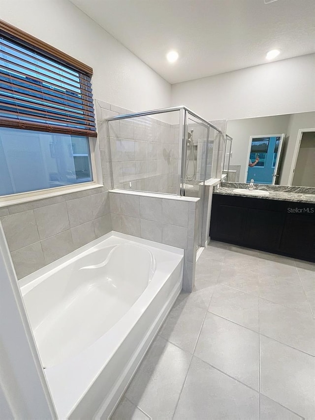 13014 Willow Grove Dr, Riverview, FL 33579 - bathroom featuring a bath, a shower stall, vanity, tile patterned floors, and recessed lighting
