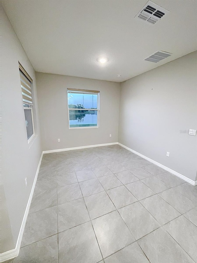 13014 Willow Grove Dr, Riverview, FL 33579 - spare room with light tile patterned floors and baseboards