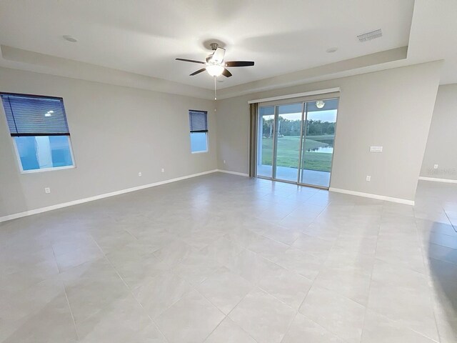 13014 Willow Grove Dr, Riverview, FL 33579 - spare room featuring ceiling fan, baseboards, and light tile patterned flooring