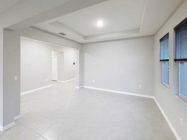 13014 Willow Grove Dr, Riverview, FL 33579 - unfurnished room featuring a tray ceiling and baseboards