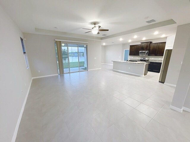 13014 Willow Grove Dr, Riverview, FL 33579 - unfurnished living room with ceiling fan, baseboards, light tile patterned floors, and recessed lighting