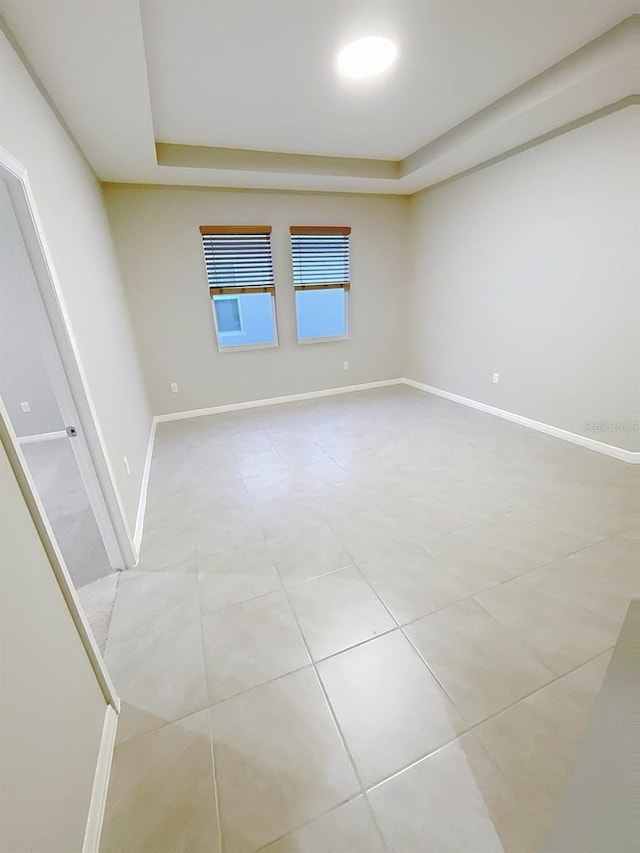 13014 Willow Grove Dr, Riverview, FL 33579 - empty room featuring a raised ceiling and baseboards