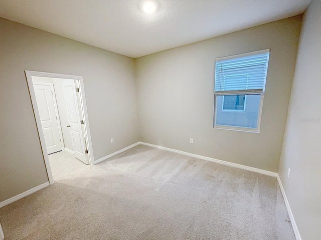 13014 Willow Grove Dr, Riverview, FL 33579 - spare room featuring light carpet and baseboards