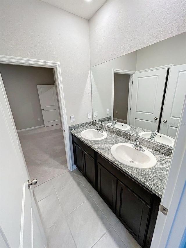 13014 Willow Grove Dr, Riverview, FL 33579 - full bathroom with double vanity, tile patterned flooring, and baseboards