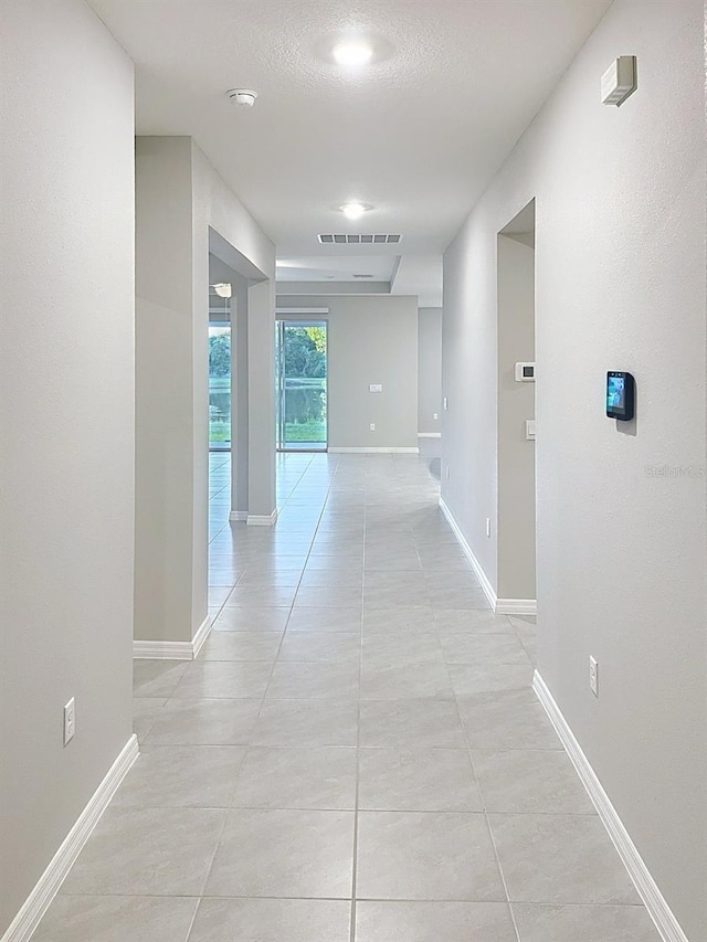 13014 Willow Grove Dr, Riverview, FL 33579 - hall featuring baseboards and light tile patterned floors