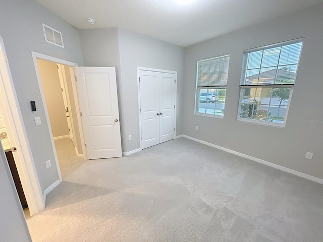 13014 Willow Grove Dr, Riverview, FL 33579 - unfurnished bedroom with light carpet and baseboards
