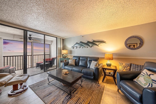 14900 Gulf Blvd Unit 308, Madeira Beach, FL 33708 - living room featuring a textured ceiling, expansive windows, and tile patterned floors