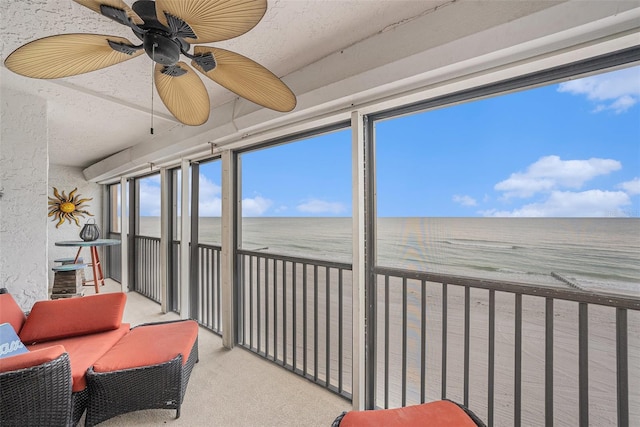 14900 Gulf Blvd Unit 308, Madeira Beach, FL 33708 - sunroom featuring view of water and beach and ceiling fan