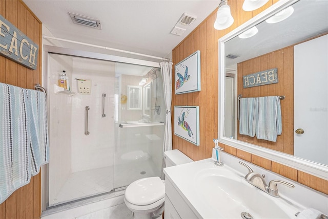 14900 Gulf Blvd Unit 308, Madeira Beach, FL 33708 - full bathroom with toilet, a shower stall, wooden walls, and vanity