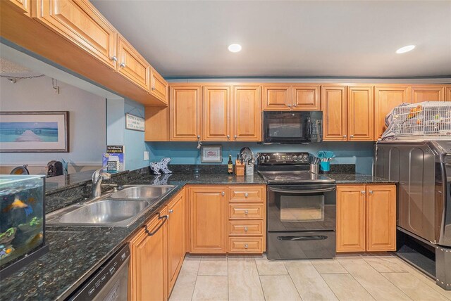 14900 Gulf Blvd Unit 308, Madeira Beach, FL 33708 - kitchen with black appliances, a sink, recessed lighting, dark stone counters, and light tile patterned floors