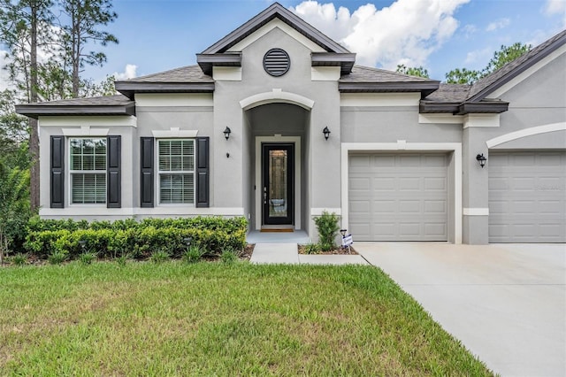 5 Sweetgum Ct N, Homosassa, FL 34446 - view of front of home featuring a garage, concrete driveway, stucco siding, and a shingled roof