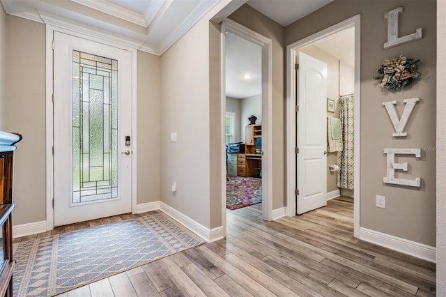 5 Sweetgum Ct N, Homosassa, FL 34446 - entryway with crown molding, plenty of natural light, light wood-type flooring, and baseboards