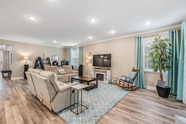 5 Sweetgum Ct N, Homosassa, FL 34446 - living room featuring hardwood / wood-style flooring, baseboards, crown molding, recessed lighting, and a fireplace