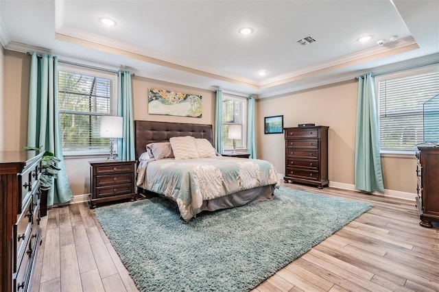 5 Sweetgum Ct N, Homosassa, FL 34446 - bedroom featuring a raised ceiling, crown molding, multiple windows, light wood-style floors, and recessed lighting