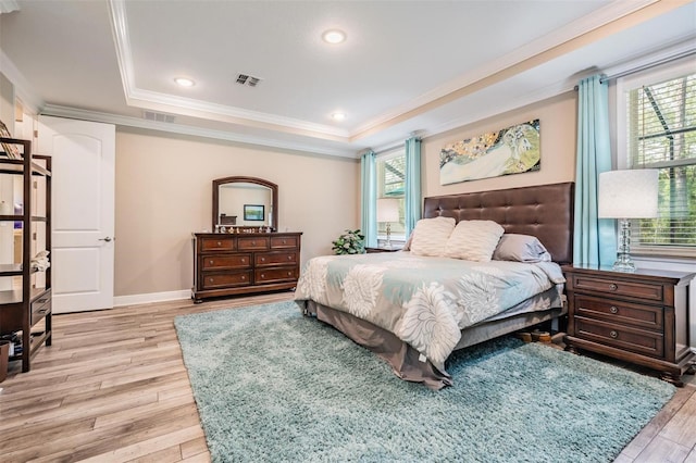 5 Sweetgum Ct N, Homosassa, FL 34446 - bedroom featuring light wood-style flooring, a tray ceiling, crown molding, baseboards, and recessed lighting