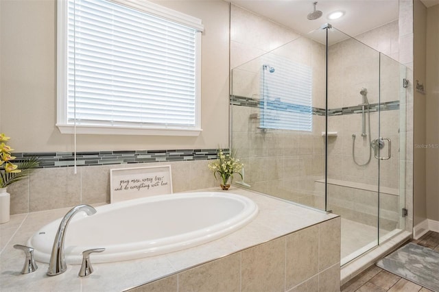 5 Sweetgum Ct N, Homosassa, FL 34446 - bathroom featuring a shower stall, a bath, and plenty of natural light