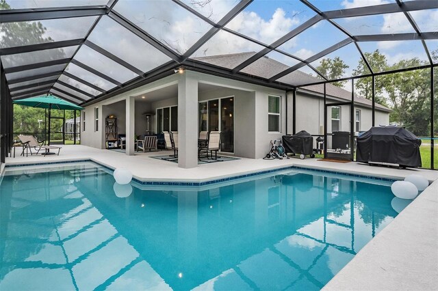 5 Sweetgum Ct N, Homosassa, FL 34446 - outdoor pool with a grill, a patio, and glass enclosure