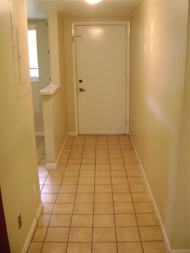 3077 Casa Del Sol Cir Unit 207, Clearwater, FL 33761 - hall with light tile patterned floors, baseboards, and electric panel