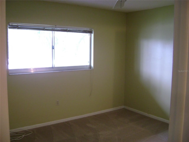 3077 Casa Del Sol Cir Unit 207, Clearwater, FL 33761 - spare room featuring baseboards