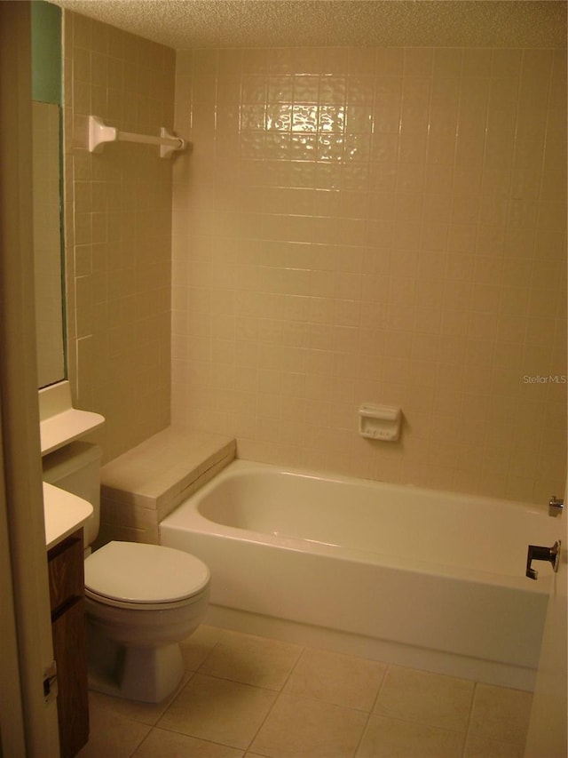 3077 Casa Del Sol Cir Unit 207, Clearwater, FL 33761 - bathroom featuring vanity, tile patterned flooring, toilet, a textured ceiling, and shower / washtub combination